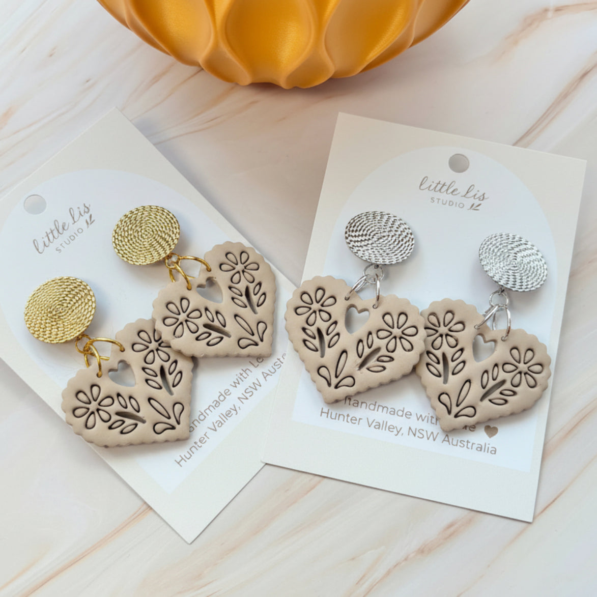 Amore statement Papel picado heart earring in a linen beige colour, handmade from polymer clay by Little Lis Studio on siler or gold textured stud