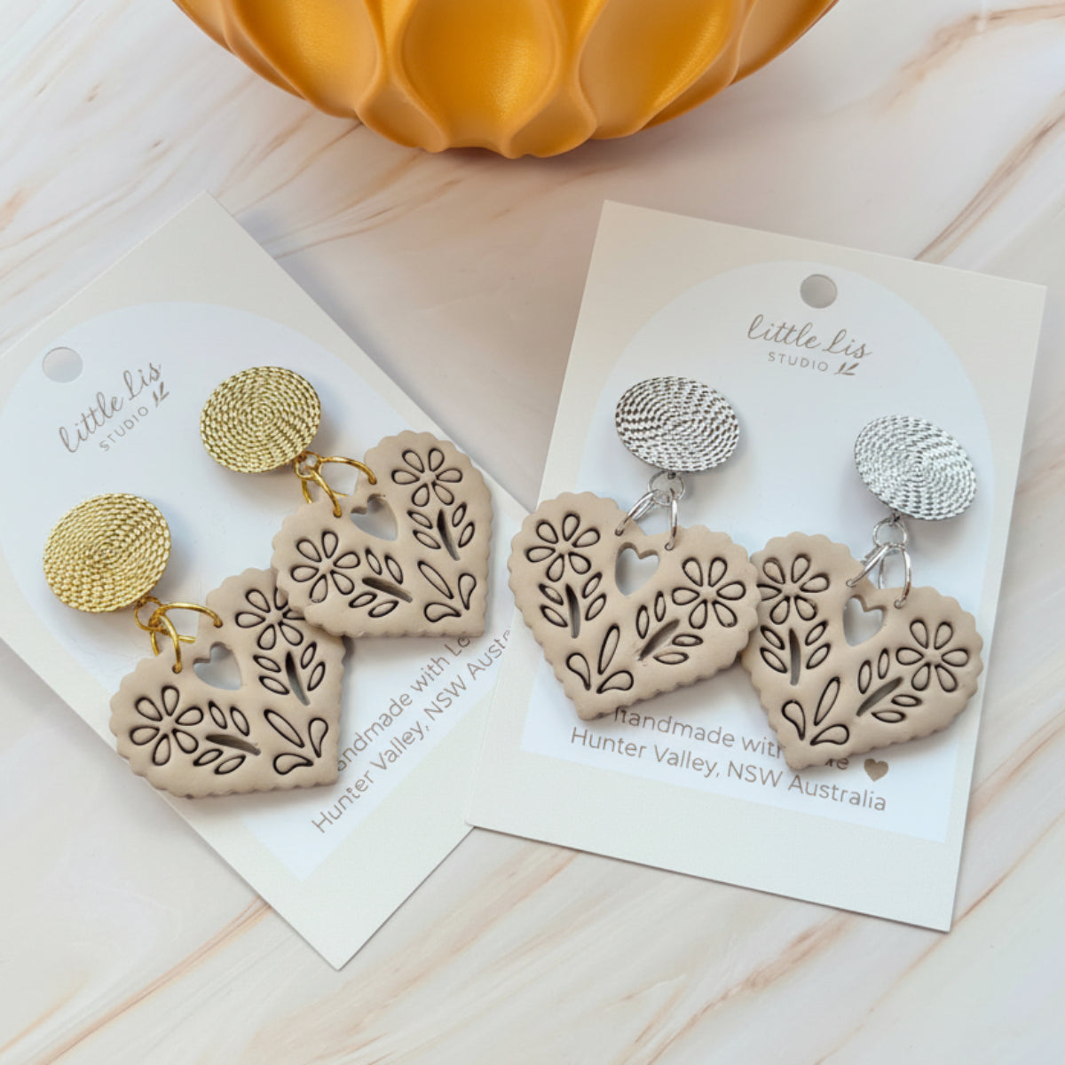 Amore statement Papel picado heart earring in a linen beige colour, handmade from polymer clay by Little Lis Studio on siler or gold textured stud