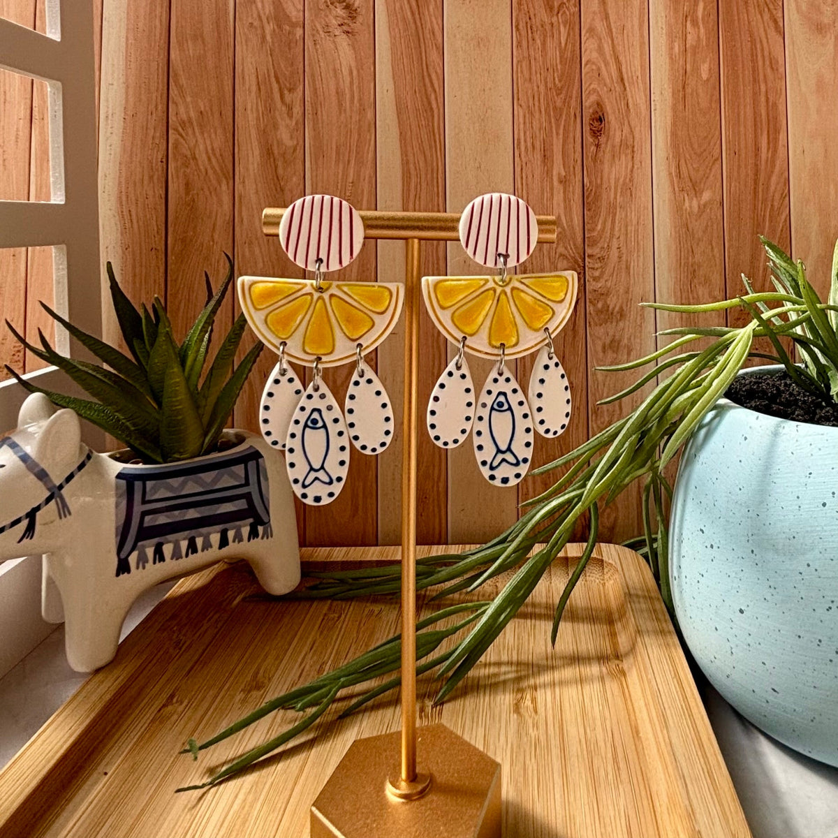Kefi Mediterranean statement earrings with red striped stud, yellow lemon slice and cobalt sardine details by Little Lis Studio