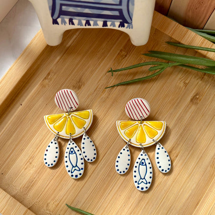 Kefi Mediterranean statement earrings with red striped stud, yellow lemon slice and cobalt sardine details by Little Lis Studio