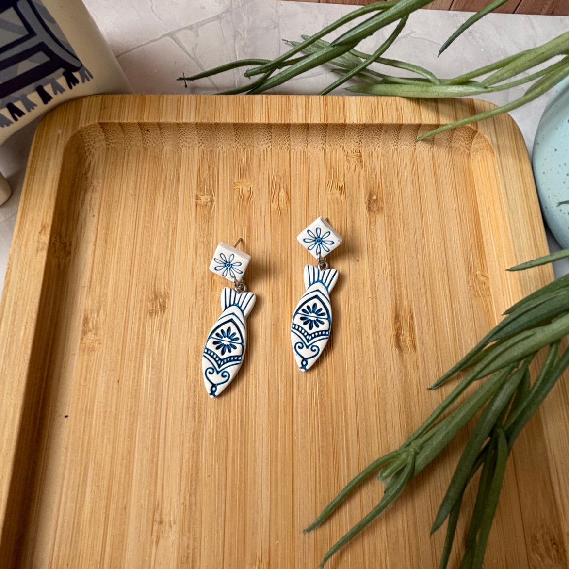 Handmade Kyma Fish polymer clay dangle earrings with Mediterranean-inspired detailing in White / Cobalt blue
