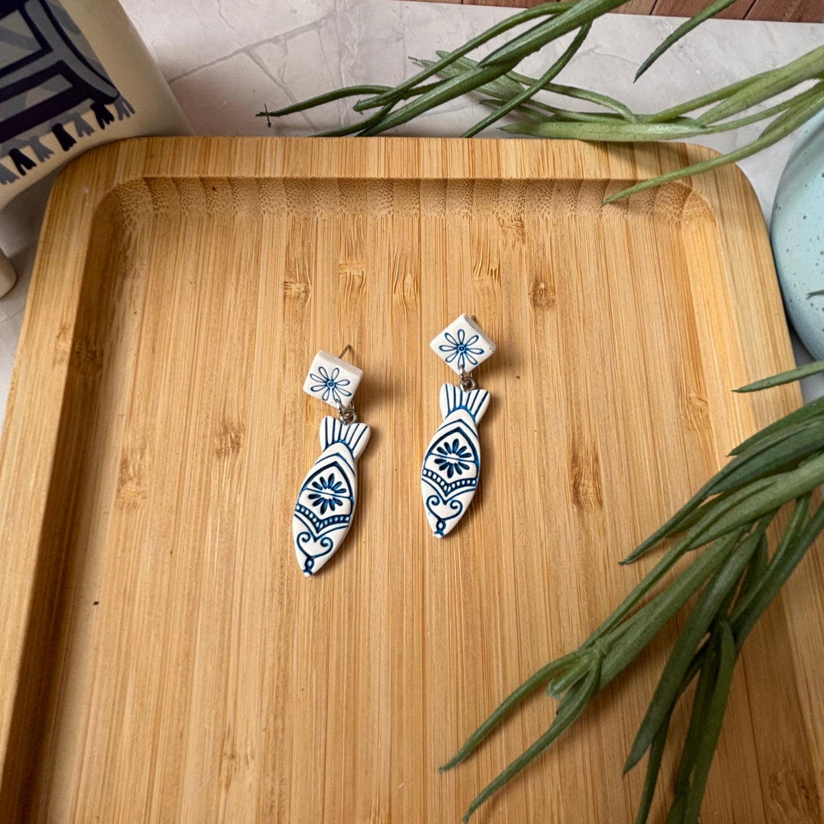 Handmade Kyma Fish polymer clay dangle earrings with Mediterranean-inspired detailing in White / Cobalt blue