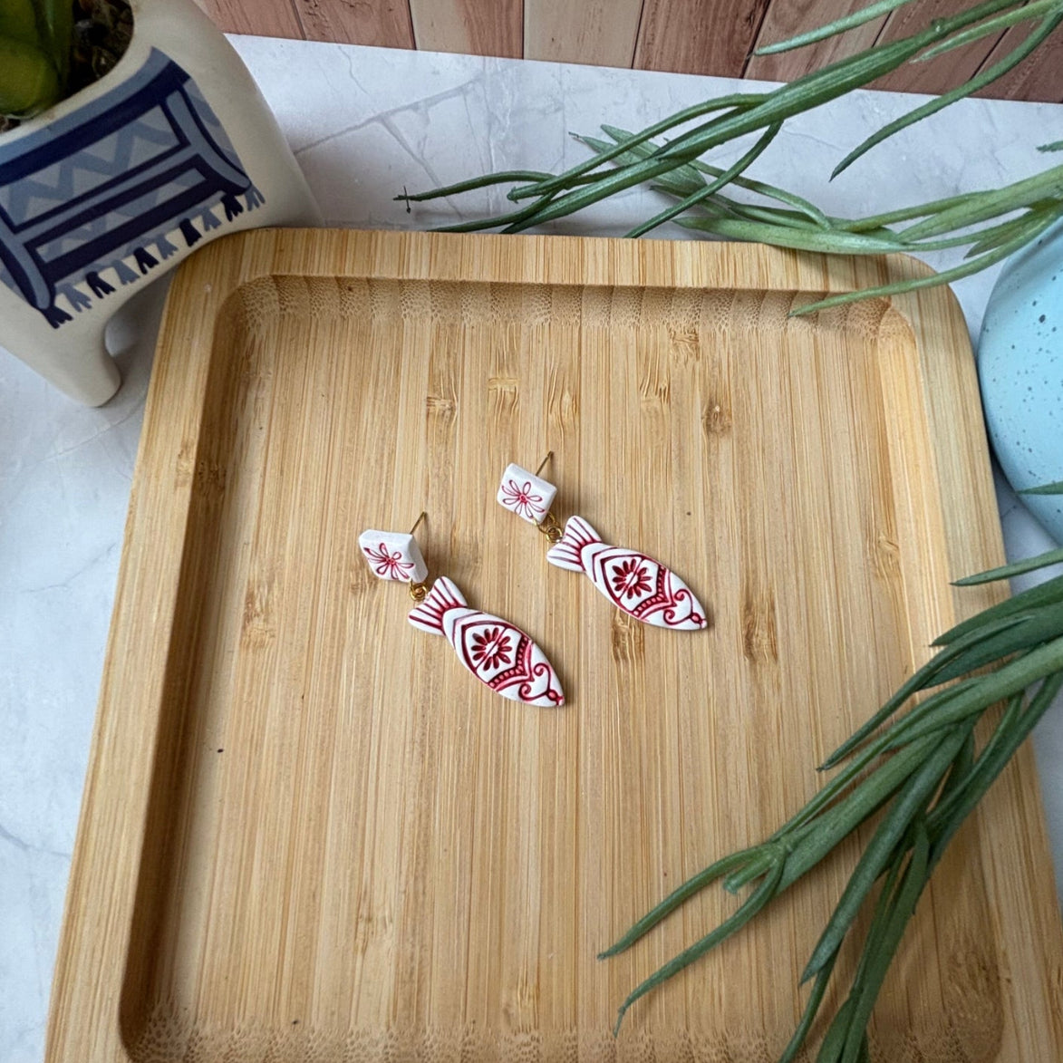Handmade Kyma Fish polymer clay dangle earrings with Mediterranean-inspired detailing in White / Red
