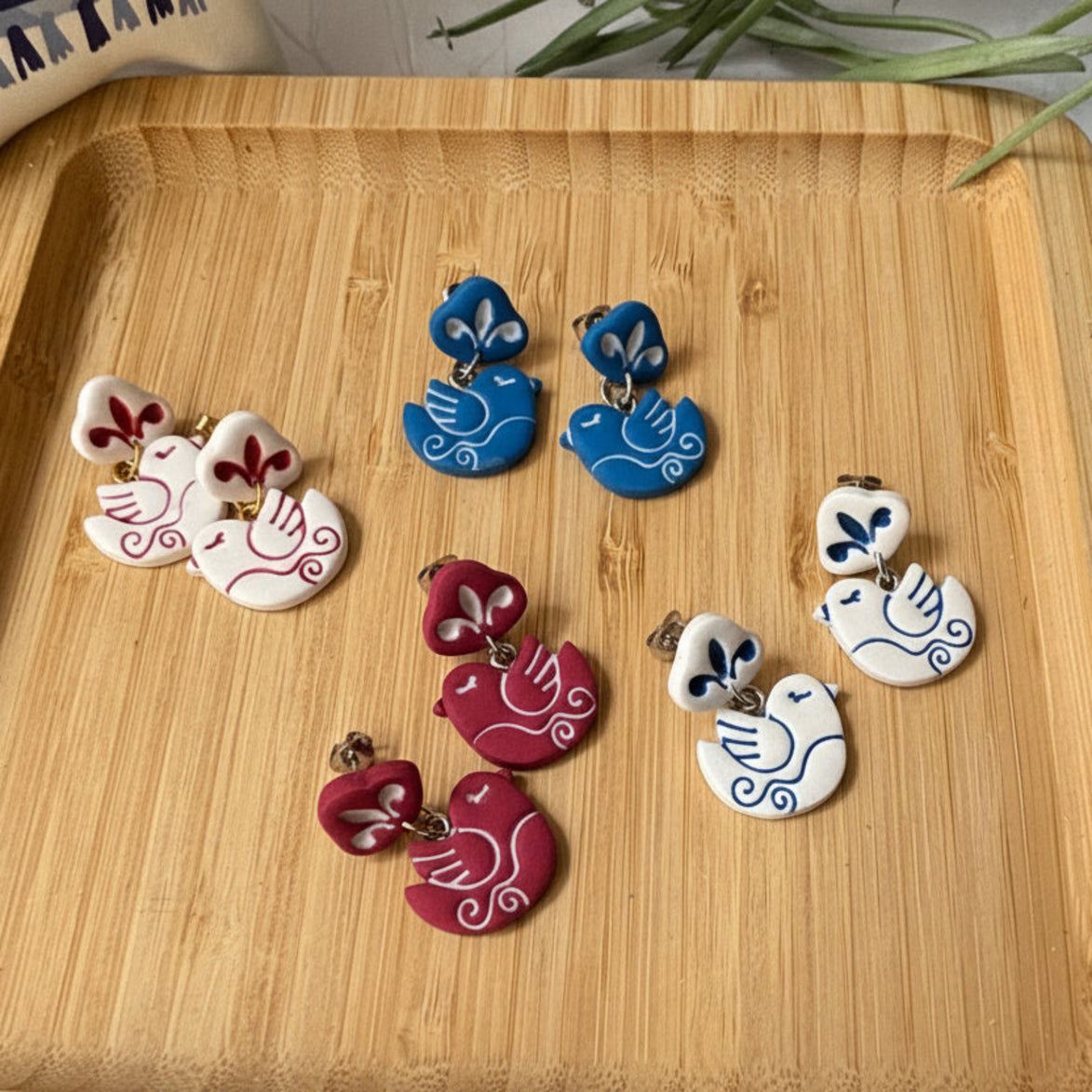 Handmade Nisi Bird Mediterranean polymer clay dangle earrings by Little Lis Studio.