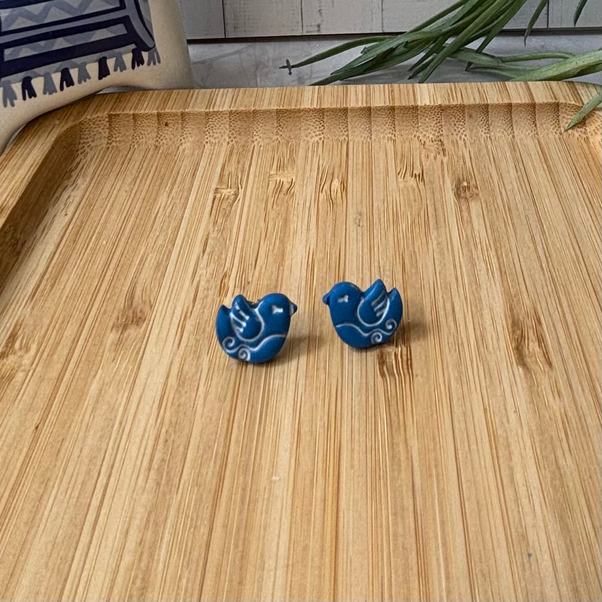 Handmade Nisi Bird Mediterranean polymer clay stud earrings in cobalt blue and white by Little Lis Studio.