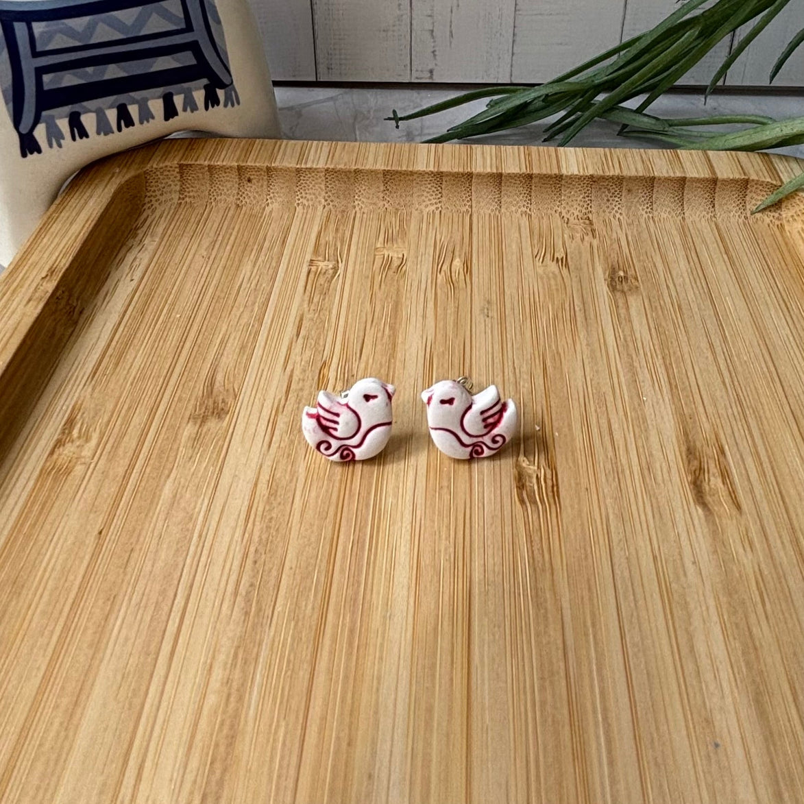  Handmade Nisi Bird Mediterranean polymer clay stud earrings in white and red by Little Lis Studio.