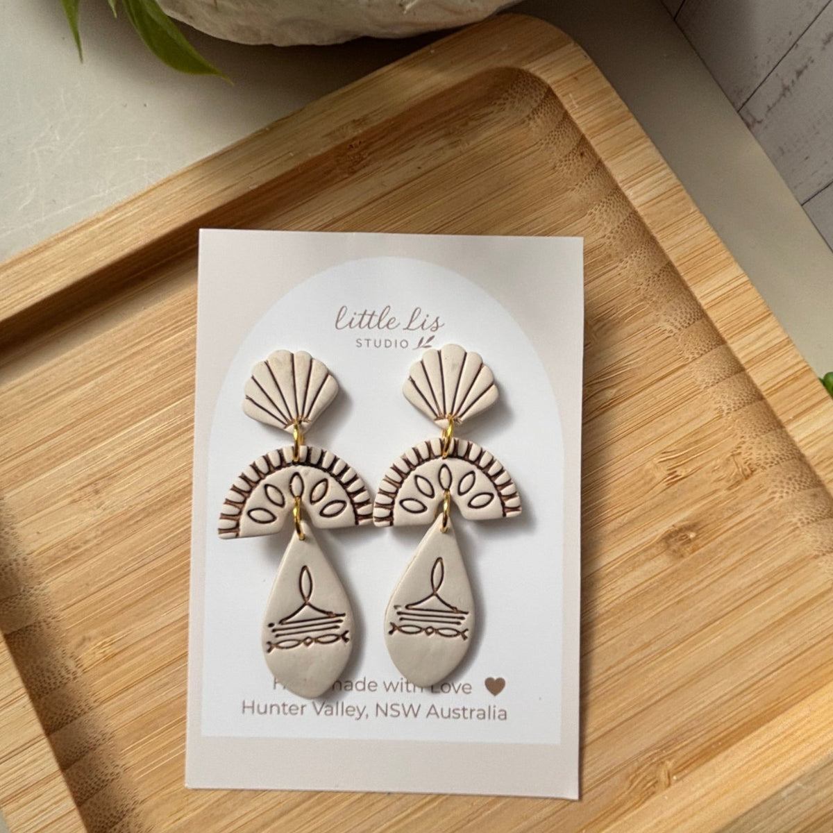 Prairie statement dangle earrings in ivory with brown inlay part of the boots and blooms collection by Little Lis Studio