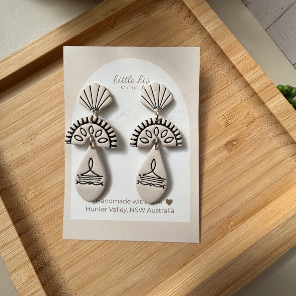 Prairie statement dangle earrings in ivory with lack inlay part of the boots and blooms collection by Little Lis Studio