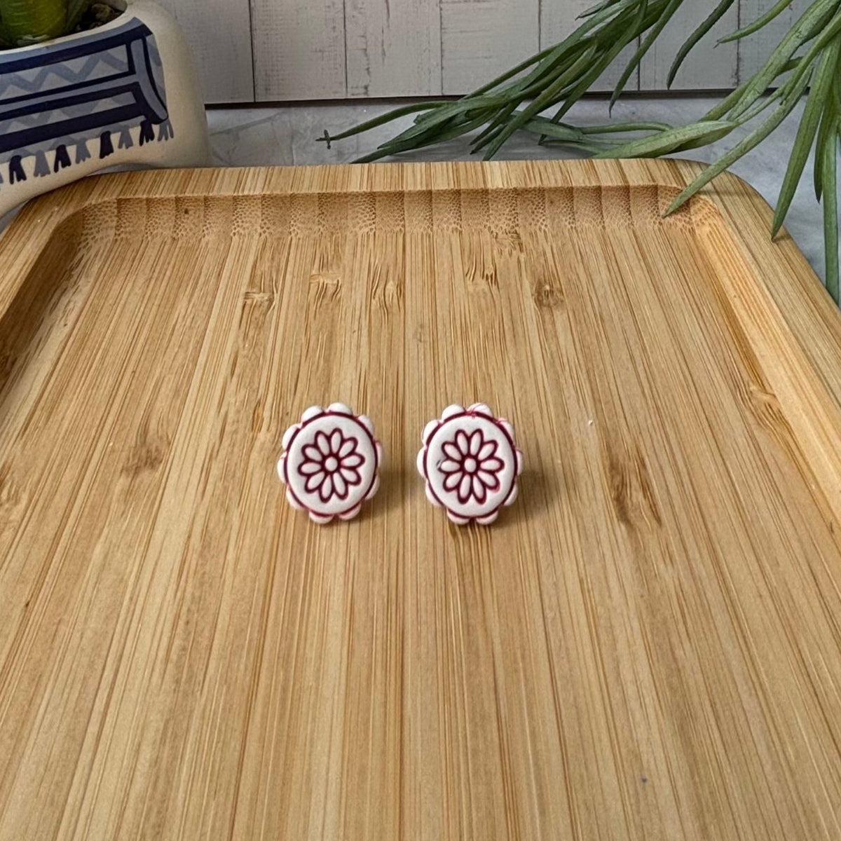 Handmade Zorba scalloped floral polymer clay stud earrings in white and red from the Little Lis Studio Aegean Collection.