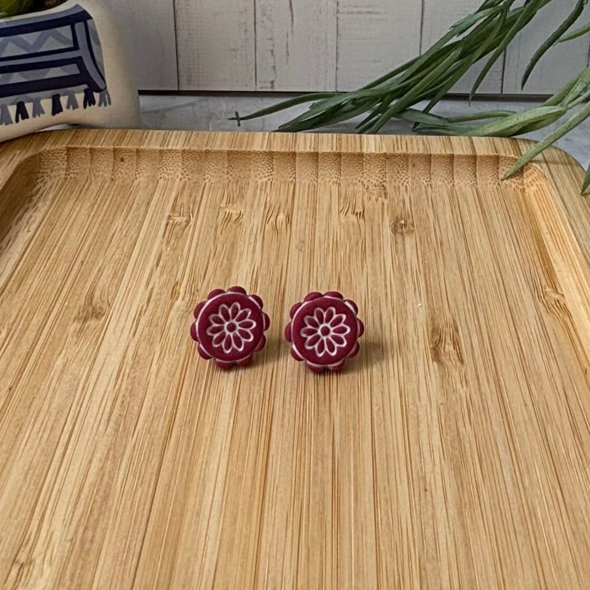 Handmade Zorba scalloped floral polymer clay stud earrings in red and white from the Little Lis Studio Aegean Collection.