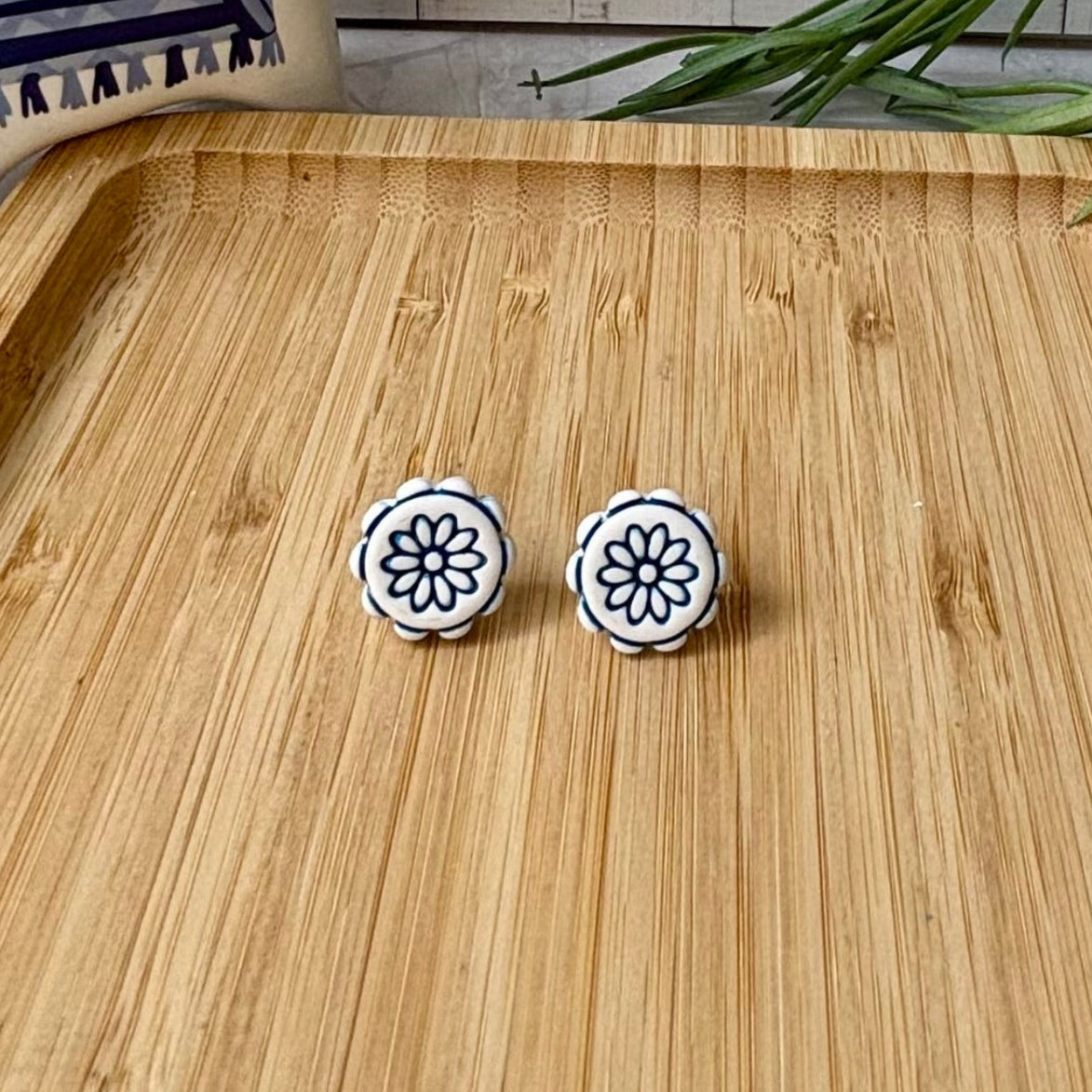 Handmade Zorba scalloped floral polymer clay stud earrings in white and cobalt blue from the Little Lis Studio Aegean Collection.