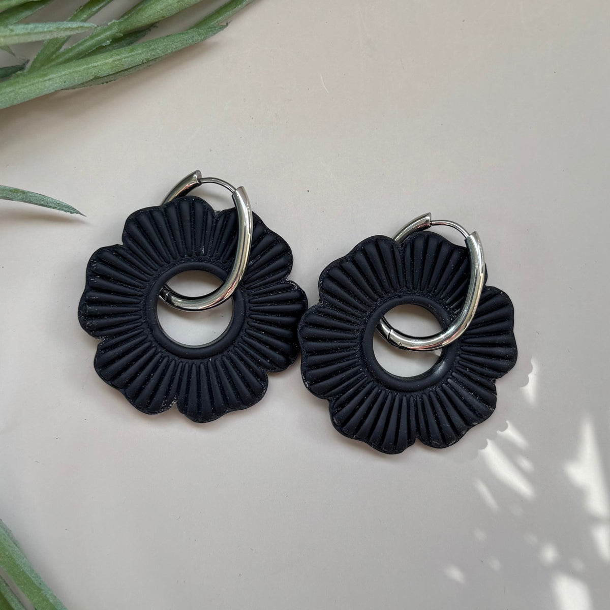 Black hoop earrings on a 18mm oval shaped hoop
