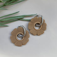 Pair of latte beige circular floral earrings on a 18mm silver hoop