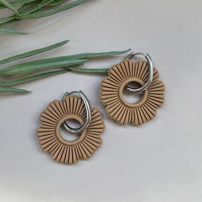 Pair of latte beige circular floral earrings on a 18mm silver hoop
